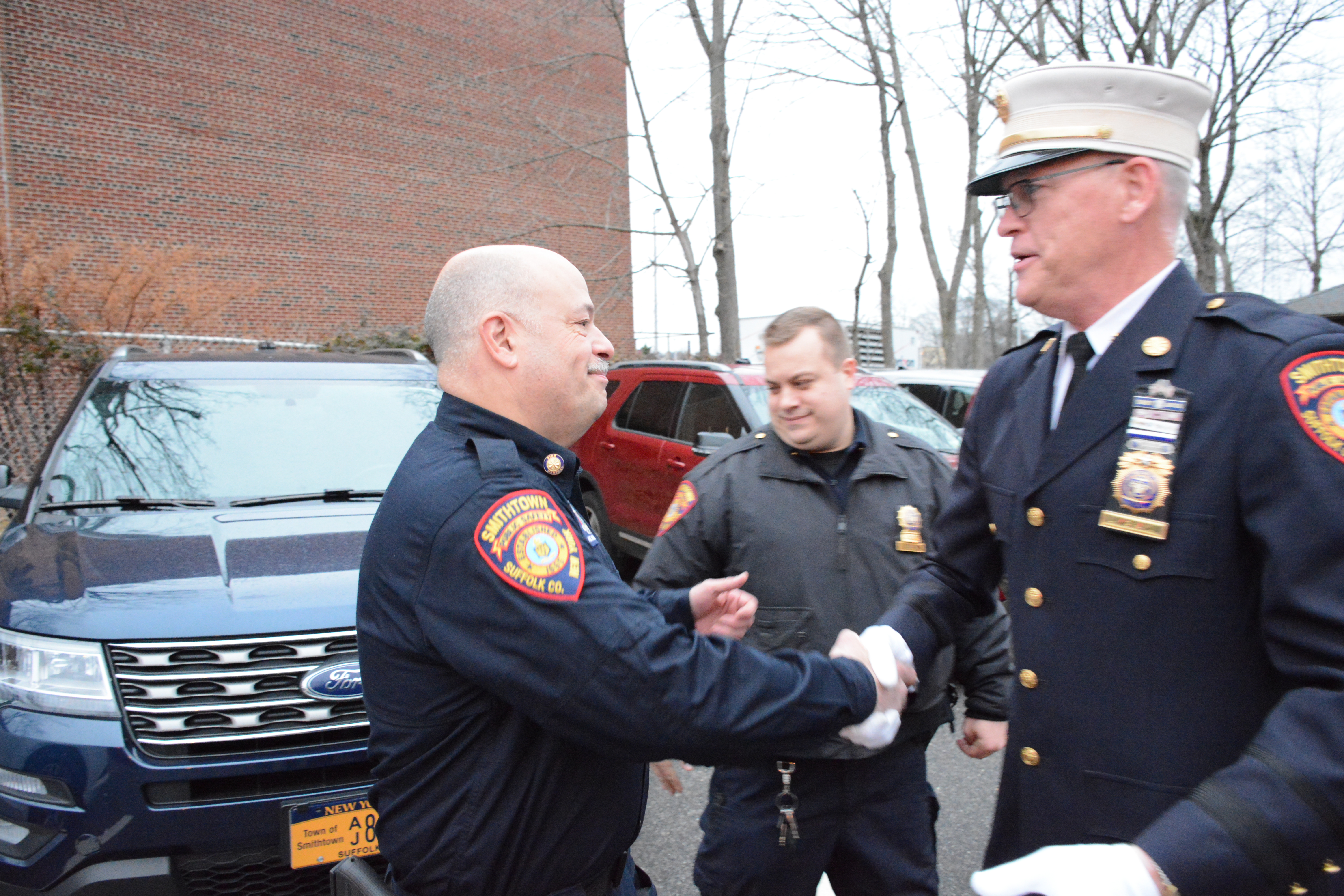 Deputy Chief FIre Marshal Andrew Brofman Congratulates Chief Mckay during the walkout. 