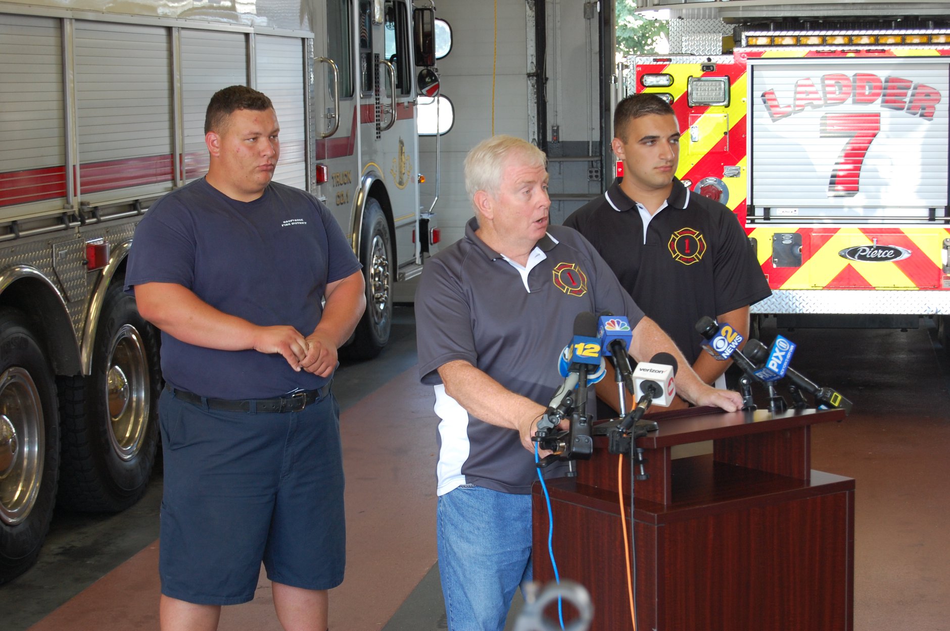 Larry Kunzig speaks to the media Jonathan Munro and Andrew Mendola are behind him Greg Gottlieb photo.