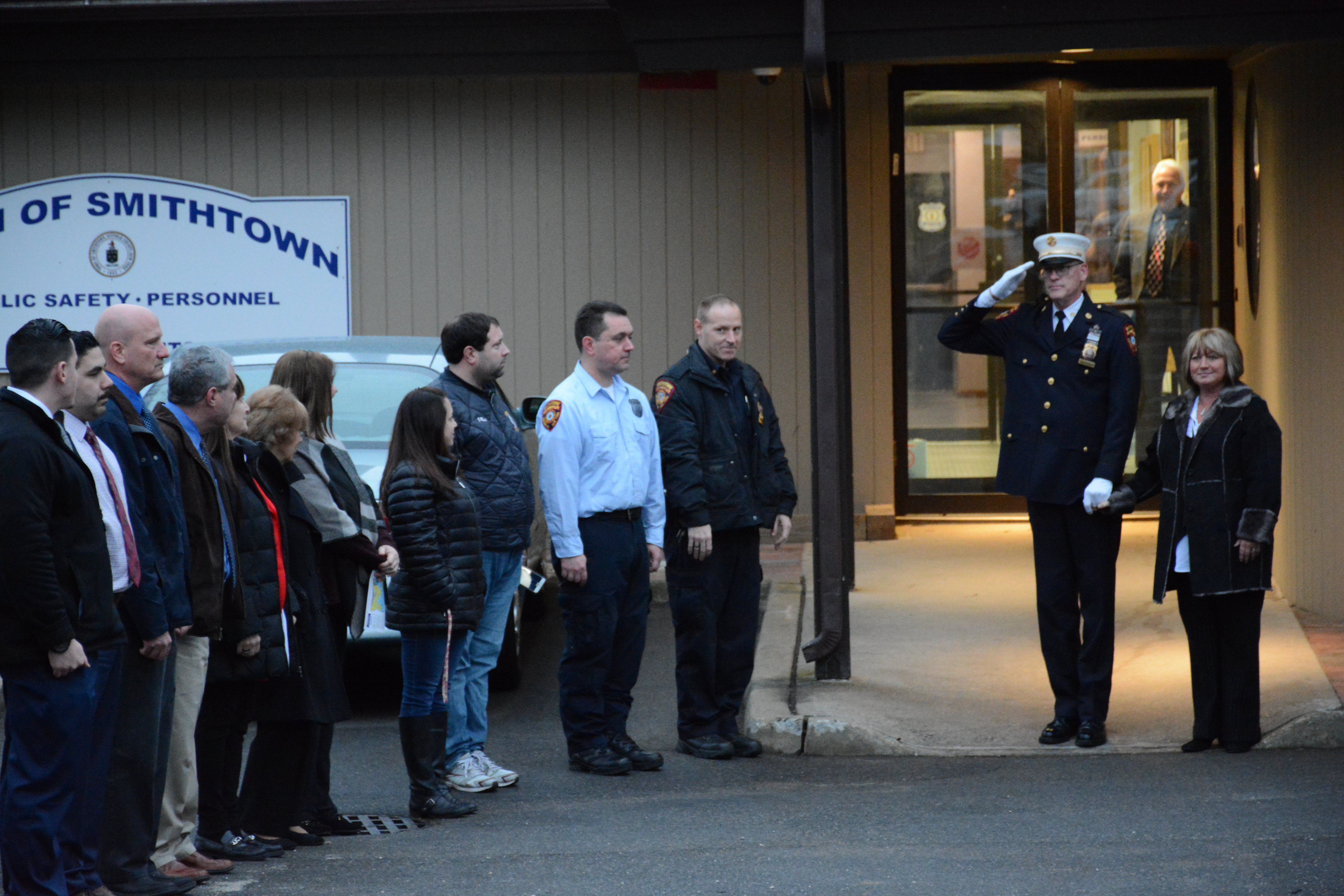 Chief Fire Marshal Richard McKay accompanied by his wife, salutes the troops during his retirement walkout.